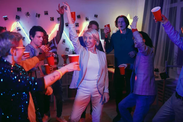 Mature woman having fun at the party — Stockfoto