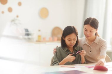 Girl Watching Her Sister Creating Card