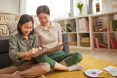 Asian Girls Drawing Something Together