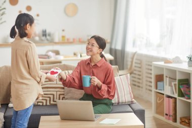 Happy Woman Getting Card From Daughter