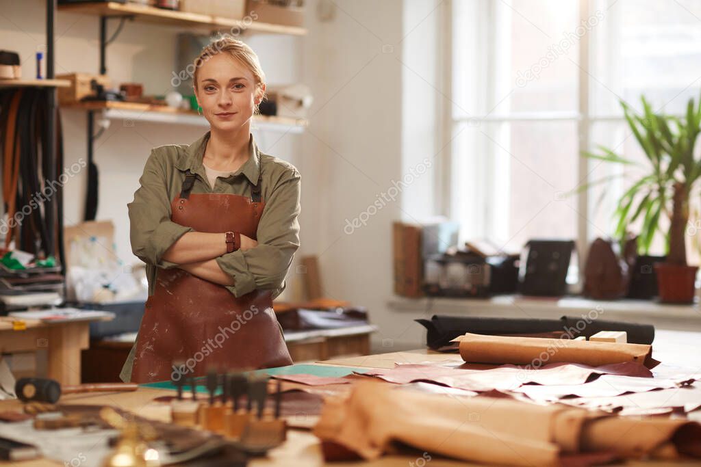 Female Artisan In Leather Workshop