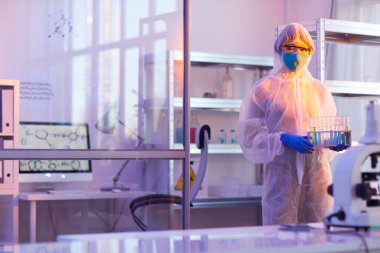 Unrecognizable Chemist With Test-Tubes