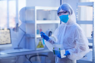 Unrecognizable Pharmacologist In Disposable Uniform