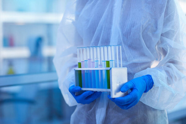 Female Laboratory Scienist With Test-Tubes