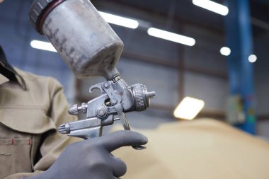 Spray-Gun With Paint In Hand