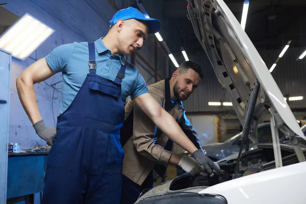 Two Repairmen Checking Car Health — Stok fotoğraf
