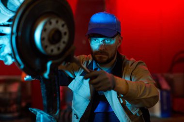 Seriuos Man Repairing Car