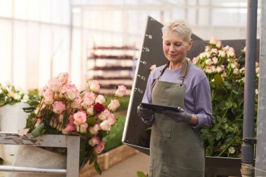 Gardener using tablet pc