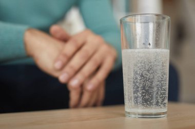 Man drinking painkillers