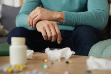 Man drinking sedative pills