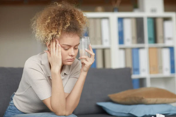 Woman drinking medicine from headache — 스톡 사진