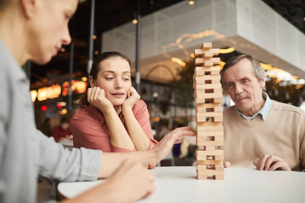 Woman playing in game with friends — Stock Photo, Image