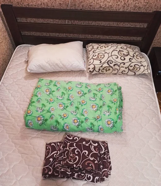 Set of bedclothes on bed in bedroom — 스톡 사진