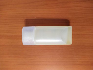 Liquid soap on wooden background