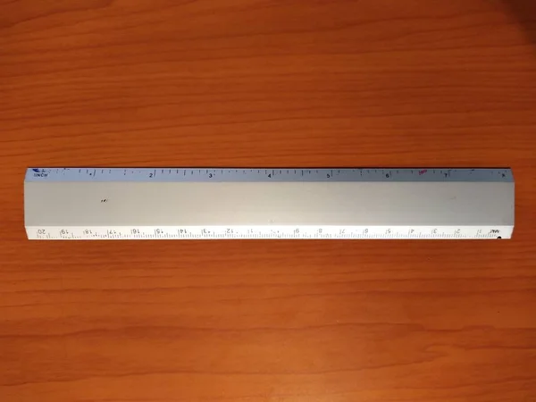 School ruler on wooden background — 图库照片