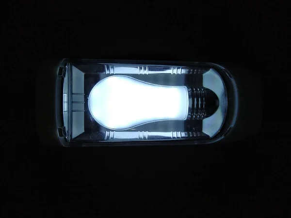 Lighting flashlight on dark background — Stock Photo, Image