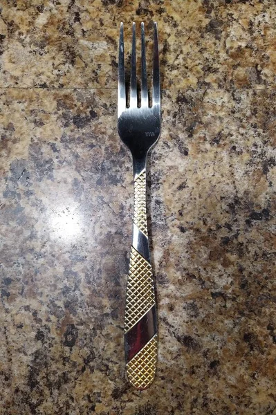 Fork no fundo da mesa da cozinha — Fotografia de Stock