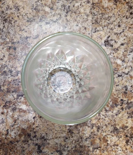 Glass on kitchen table background — Stock Photo, Image