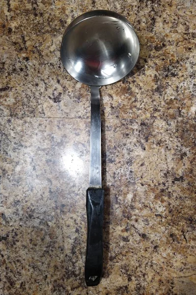 Kitchen scoop on kitchen table background — Stock Photo, Image