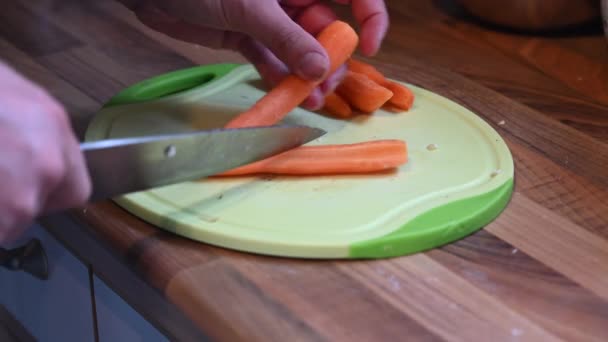Someone Cutting Carrot Small Pieces Board Sharp Knife — Stock Video