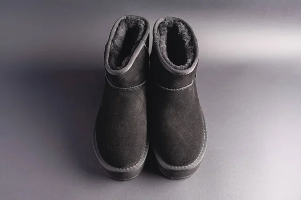 Black Suede Uggs Stock Photo Black Background — Stock Photo, Image