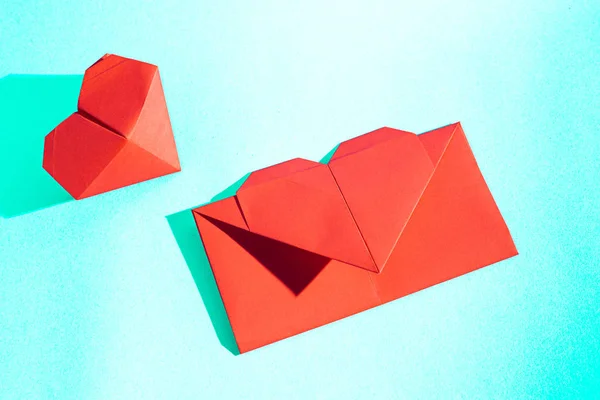 Handmade love letter. Origami from colored paper. Stock photo. Made with love.