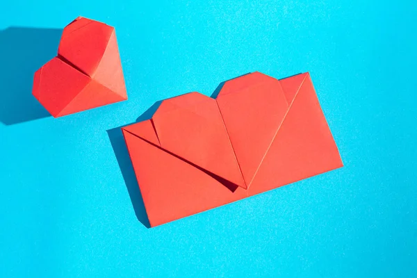 Handmade love letter. Origami from colored paper. Stock photo. Made with love.