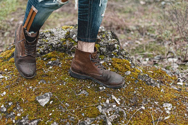 Guy hiking in comfortable hiking boots. Boots close-up stock photo.