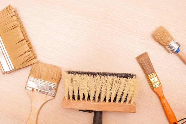 A large set of different construction brushes. Stock photo set of brushes for varnishing and primer, for different tasks. Empty space.