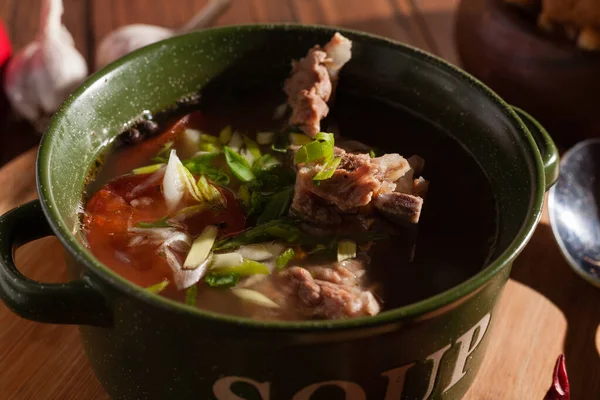 Rustic Meat Bone Soup Broth Sprinkled Green Onions Wooden Table — Stock Photo, Image