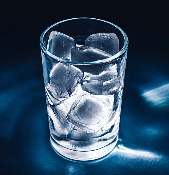 Ice cubes in a glass. Ice in a glass is highlighted.