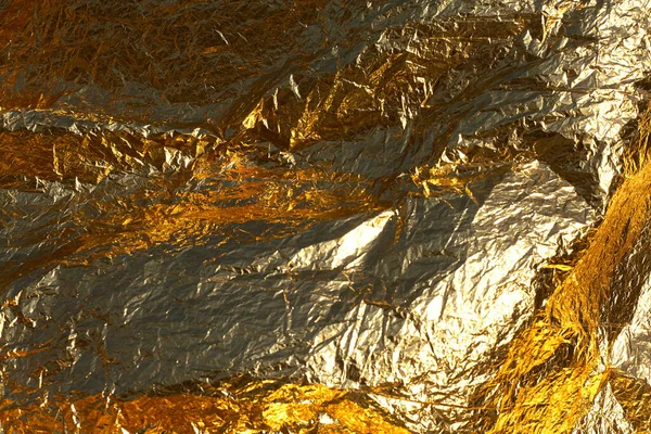 Texture of a thin crumpled sheet of foil. Crumpled foil background. Stock photo foil. Gold chrome color.