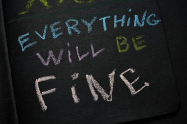 Everything will be fine. The inscription in chalk on a black paper background. clipart