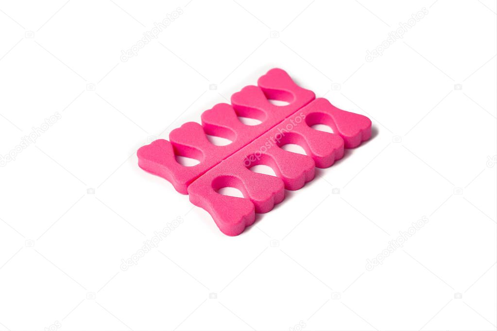 Toe separator isolated on a white background. Pair of toe separator in the form of small hearts. Spongy material.