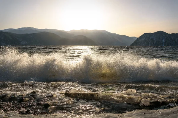 lake mountains ice wave splash dawn sun