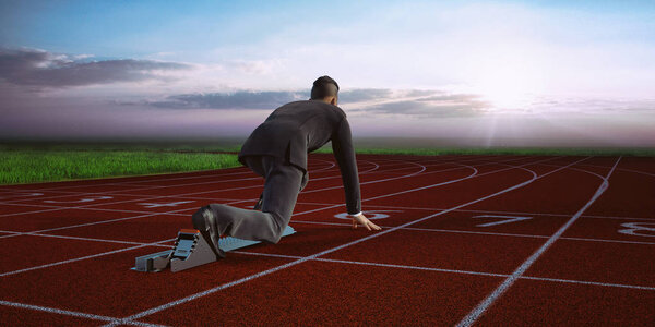 Young businessman ready to race and compete at field