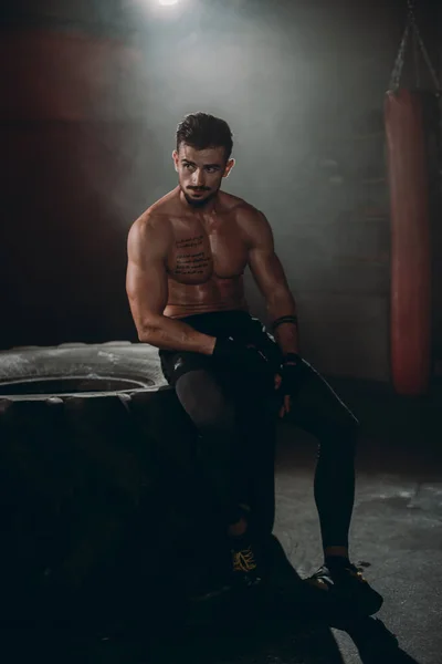 In front of the camera charismatic guy with a brutal face after his workout training — Stock Photo, Image