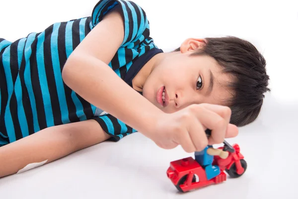 Little boy playing with car toy free time after study from school — Stock Photo, Image