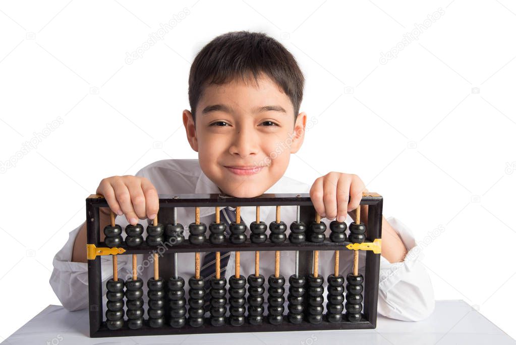 Little boy using abacus to study mathematics education class 