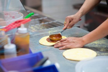 Worker making pizza in the restuarant