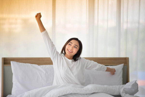 Asain teenager woman just wake up in the morning in the bedroom