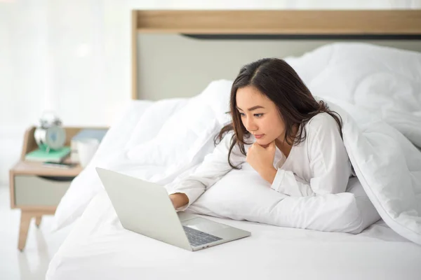 Asian woman use notebook work from home