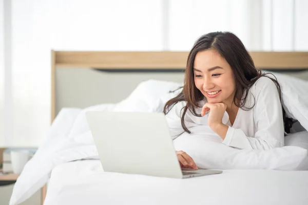 Asian woman use notebook work from home