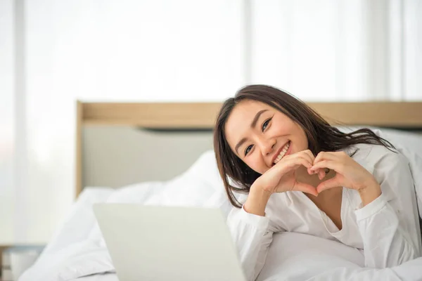 Asian woman use notebook work from home