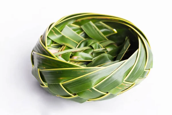 Bowl of coconut leaves on white background — Stock Photo, Image