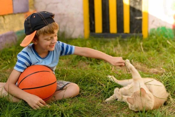 A guy is a basketball player on the court for sports. Warm summe