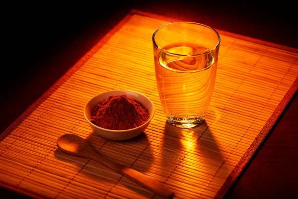 Solar spice a turmeric with water. Fragrant spice with vitamins. Stock Picture