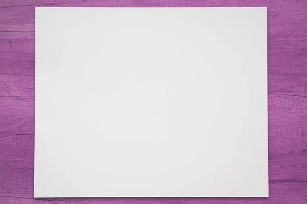 White blank album on purple background with wooden texture. Space for text — 스톡 사진