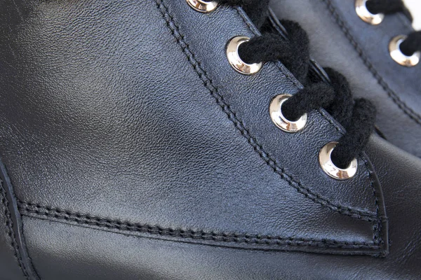 Close up of sew on natural leather black boots with shoelaces — 스톡 사진