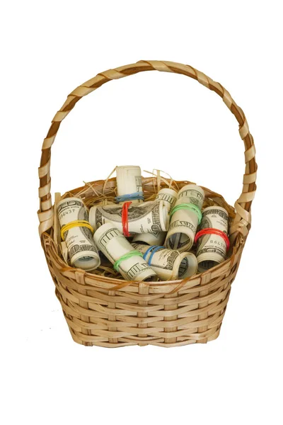 A wicker basket full of money in rolls isolated on white background. — Stock Photo, Image